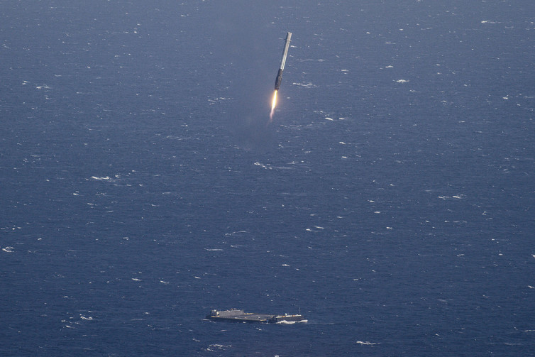 The SpaceX rocket approaching the landing platform