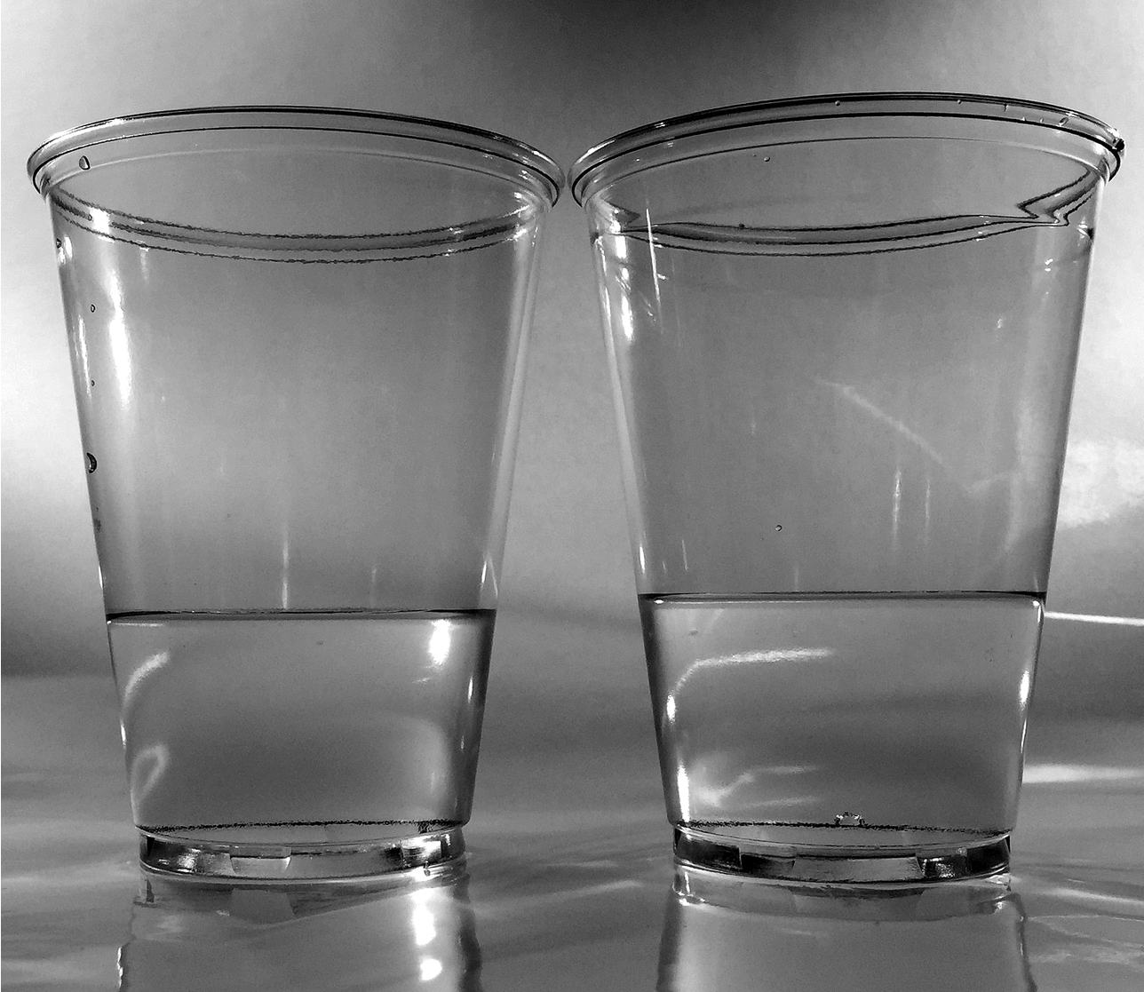 pouring water into a cup